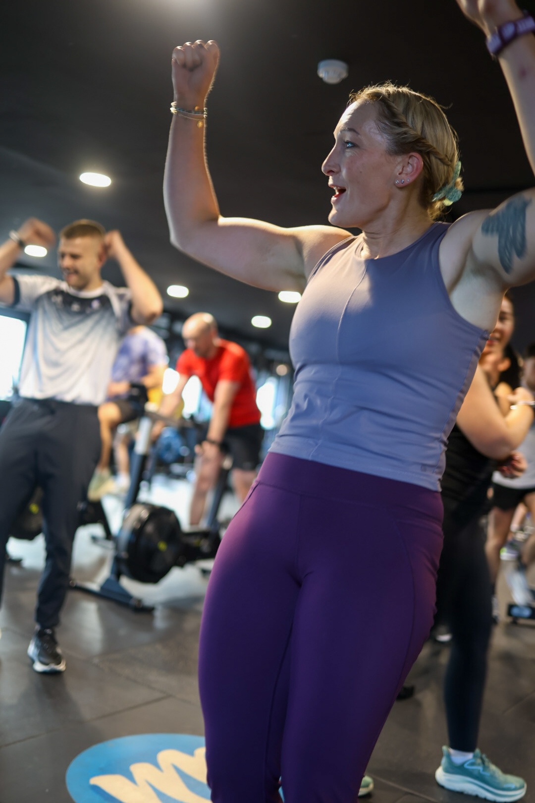 Woman celebrating while training at Momentum Fitness